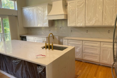 quartz-kitchen-countertop-with-full-height-backplash-and-waterfall-legs